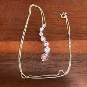 JC Jewelers signed 925 silver necklace with pink and clear CZ pendant.